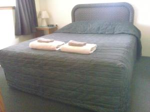 Postel nebo postele na pokoji v ubytování Rangiora Lodge Motel