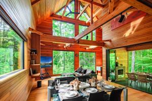 a living room with a couch and a table at Phoenix Chalets by HHG in Hakuba
