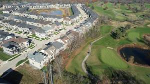 an aerial view of a golf course with houses at Serene High-celling Retreat in Oakville +3 photos