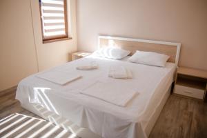 A bed or beds in a room at Summer Blue - Holiday House