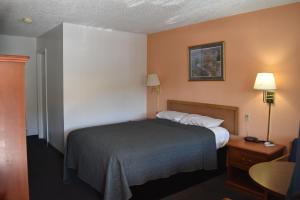 a hotel room with a bed in a room at Arlington inn in Arlington