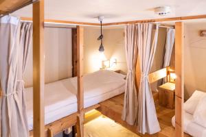 Postel nebo postele na pokoji v ubytování Tokyo Hikari Guesthouse + 36 fotografií