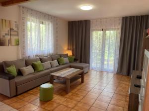 a living room with a couch and a table at Fabris Apartments with pool and top location near sea in Novigrad Istria