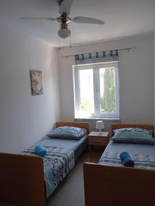 Ein Bett oder Betten in einem Zimmer der Unterkunft House Daniela