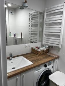 Kúpeľňa v ubytovaní Apartament na Wydmach