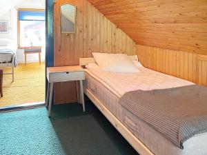 Una cama o camas en una habitación de 5 person holiday home in SÖLVESBORG