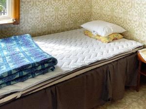 Una cama o camas en una habitación de 5 person holiday home in SÖLVESBORG