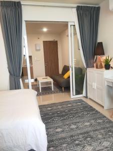 a bedroom with a bed and a living room at The ocean city view in Kota Kinabalu +21 photos