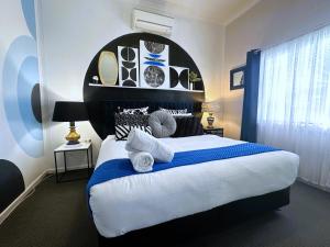 Ένα ή περισσότερα κρεβάτια σε δωμάτιο στο Eleda House Hunter Valley