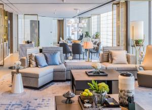 a living room with couches and a table at InterContinental Beijing Sanlitun by IHG in Beijing
