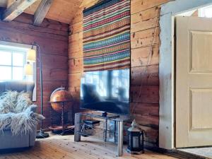 Et tv og/eller underholdning på 6 person holiday home in Grimo