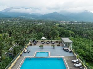 an aerial view of a resort with a swimming pool at Distrikt 9 in Palakkad
