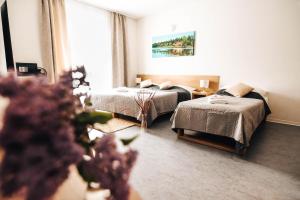 Katil atau katil-katil dalam bilik di Hotel Forea