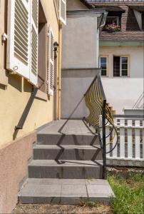 a set of stairs leading up to a house at Les Boisés à Kaysersberg+ 1 place de parking in Kaysersberg