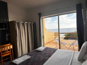 Postel nebo postele na pokoji v ubytování Hôtel A RENA D'ORU