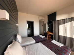 Postel nebo postele na pokoji v ubytování Hôtel A RENA D'ORU