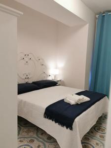 Postel nebo postele na pokoji v ubytování B&B casa Petrarca