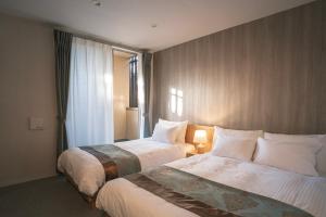 Voodi või voodid majutusasutuse 谷町君Hotel 京都駅東29 toas