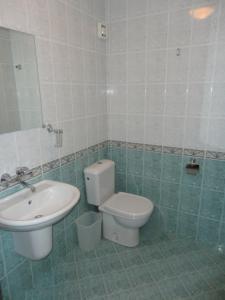 a bathroom with a toilet and a sink at Sargas Sozopol in Sozopol