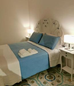 Postel nebo postele na pokoji v ubytování B&B casa Petrarca