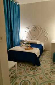 Postel nebo postele na pokoji v ubytování B&B casa Petrarca