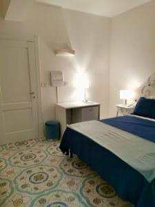 Postel nebo postele na pokoji v ubytování B&B casa Petrarca