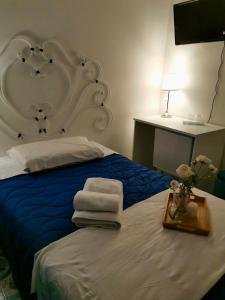 Postel nebo postele na pokoji v ubytování B&B casa Petrarca