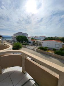 a balcony with a view of a street and buildings at Doana Apartments in Vir