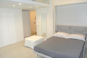 A bed or beds in a room at Duomo Inn