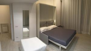 A bed or beds in a room at Duomo Inn