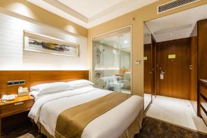 Postel nebo postele na pokoji v ubytování Maixinge Boutique Hotel Chuansha Branch