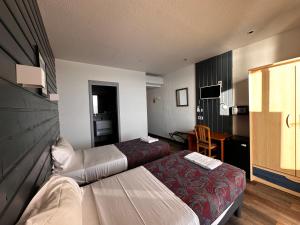 Postel nebo postele na pokoji v ubytování Hôtel A RENA D'ORU