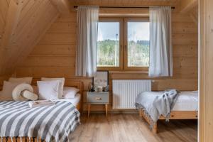 Posteľ alebo postele v izbe v ubytovaní Domek Pana Jana
