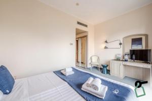 Kuchyň nebo kuchyňský kout v ubytování Hotiday Room Collection - Stresa