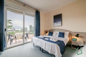 Postel nebo postele na pokoji v ubytování Hotiday Room Collection - Stresa + 37 fotografií
