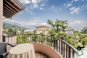 a balcony with a view of the water at Hotiday Room Collection - Stresa in Stresa