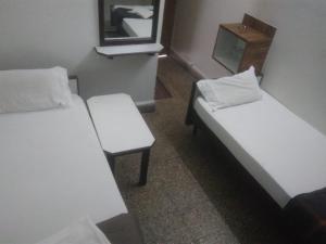 Hotel Kartiki客房内的一张或多张床位