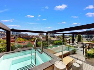 a swimming pool on the roof of a building at Modern, Luxury Retreat with Gym and Pool in Melbourne