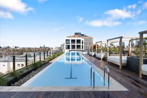a swimming pool on the roof of a building at Modern, Luxury Retreat with Gym and Pool in Melbourne