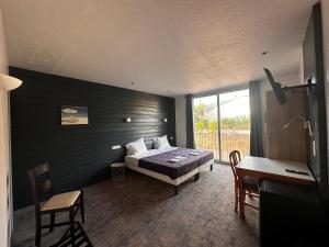 Postel nebo postele na pokoji v ubytování Hôtel A RENA D'ORU