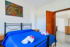 Postel nebo postele na pokoji v ubytování Villa Iris Punta Prosciutto