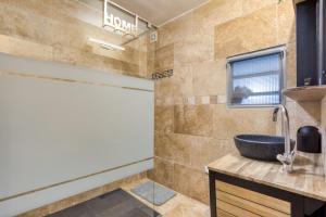 a bathroom with a sink and a mirror at Marina Port Camargue in Le Grau-du-Roi +16 photos