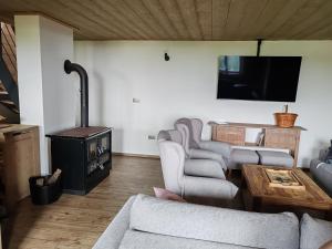A television and/or entertainment centre at Chata Čerenka