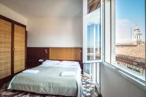 מיטה או מיטות בחדר ב-Hotel Clodia
