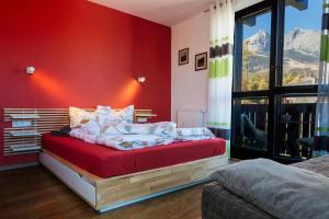 A bed or beds in a room at Apartment Primulka