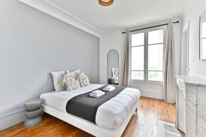 Voodi või voodid majutusasutuse Appartement Vue panoramique sur la capitale toas