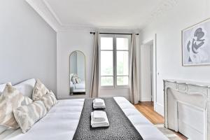 Postel nebo postele na pokoji v ubytování Appartement Vue panoramique sur la capitale