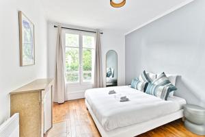 Voodi või voodid majutusasutuse Appartement Vue panoramique sur la capitale toas