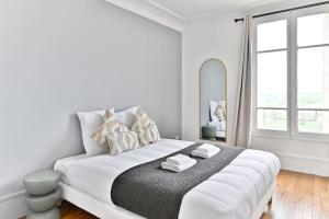 Voodi või voodid majutusasutuse Appartement Vue panoramique sur la capitale toas