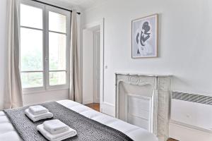 Voodi või voodid majutusasutuse Appartement Vue panoramique sur la capitale toas